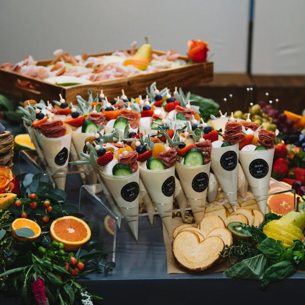Handheld charcuterie cones with vegetables, meats and fruit