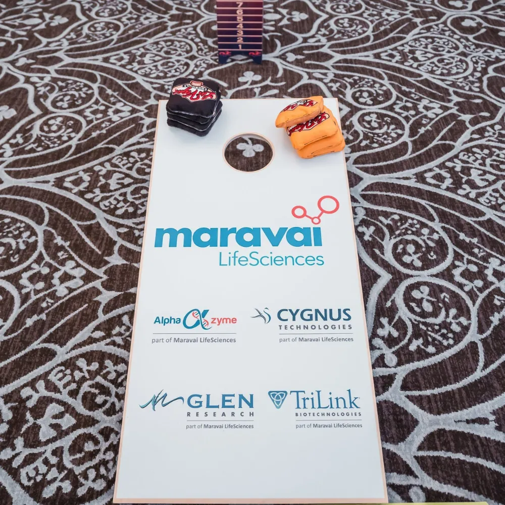Maravai LifeSciences personalized cornhole board with subsidiary logos