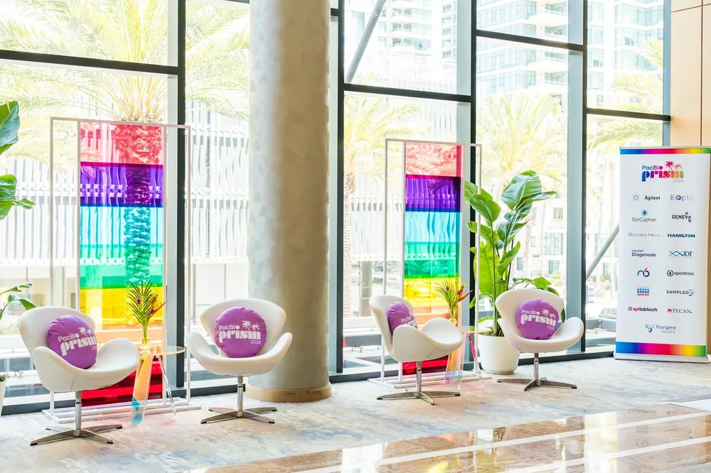 PacBio Prism 2026 swan chair lounge with rainbow installation