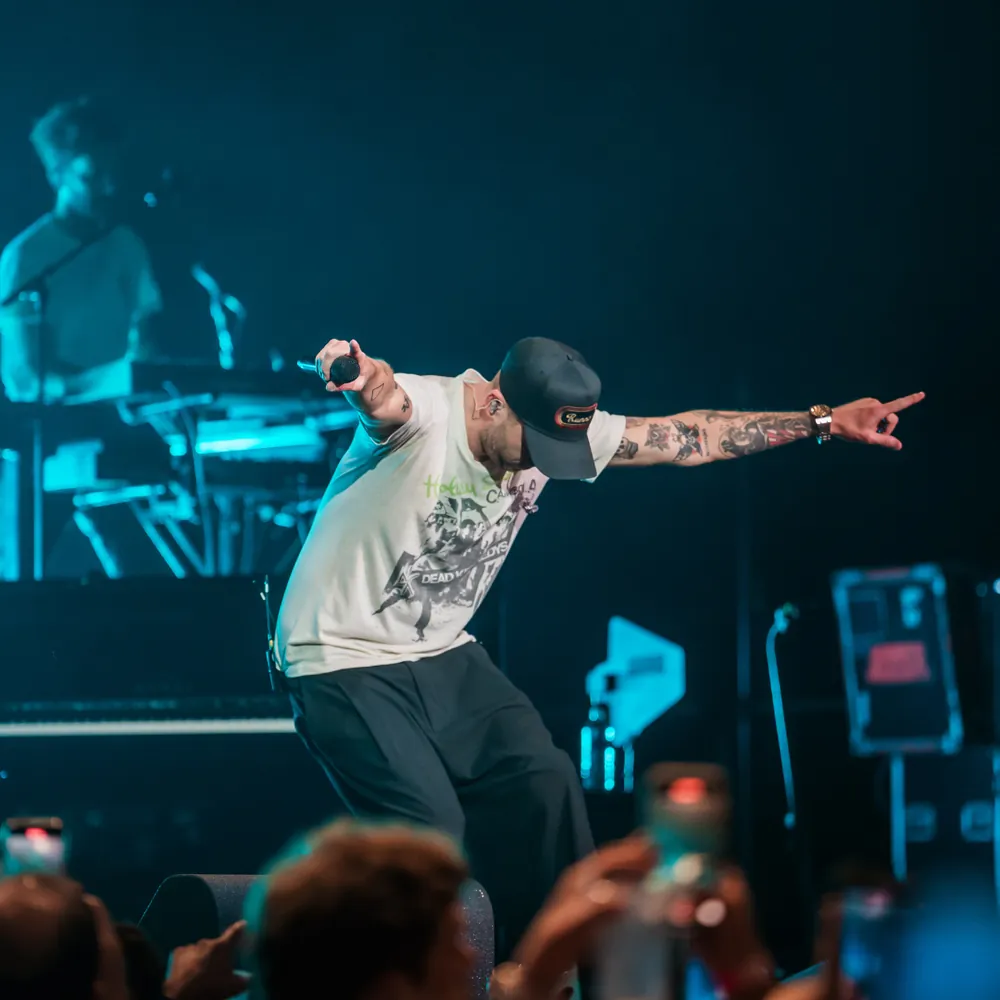 Ryan Tedder of OneRepublic performing on stage in Denver