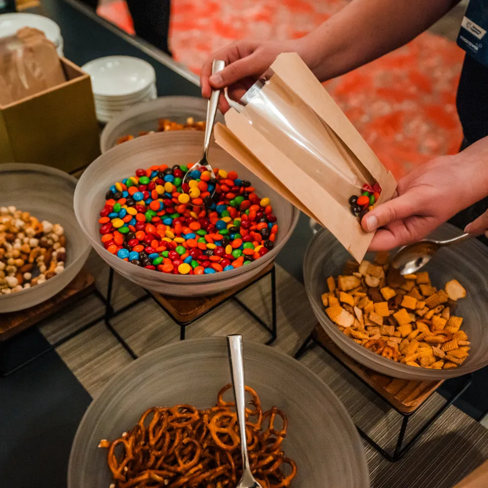 DIY trail mix candy and snack buffet with assorted bowls